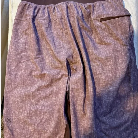 FOUR PAIRS OF VINTAGE LIMITED EDITION LULULEMON PACEBREAKER 9" ATHLETIC SHORTS